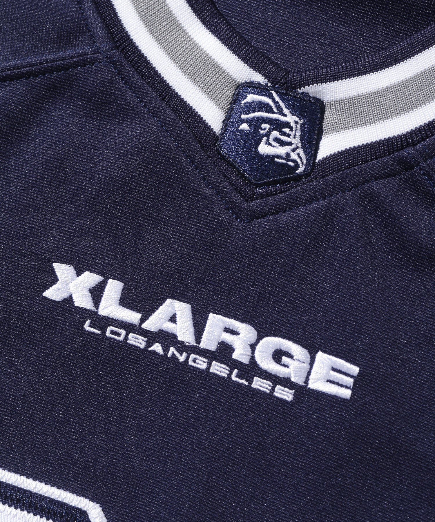 เสื้อยืดแขนสั้น XLARGE รุ่น PANELED FOOTBALL JERSEY