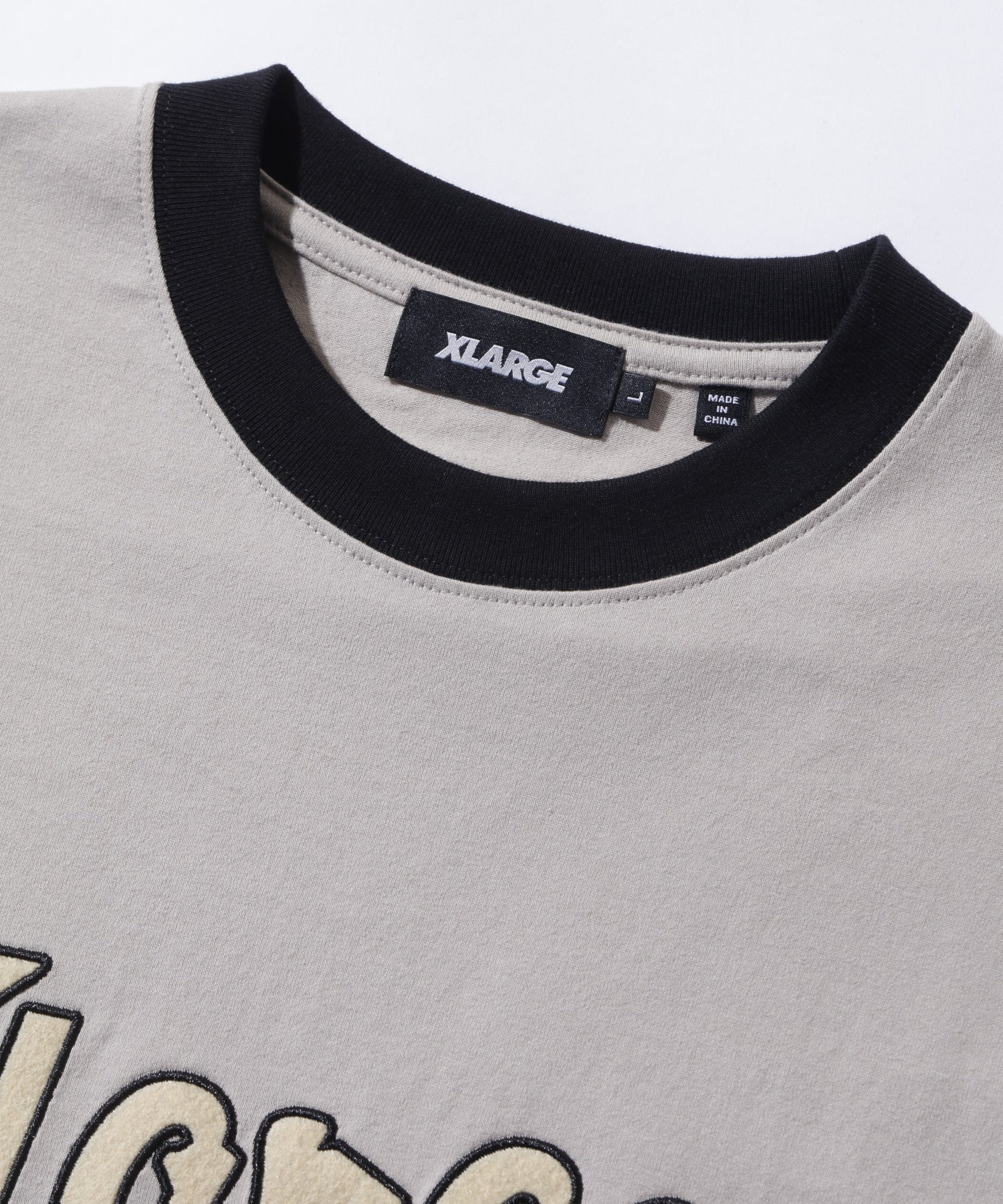 เสื้อยืดแขนสั้น XLARGE รุ่น Retro Script Logo Ringer S/S Tee