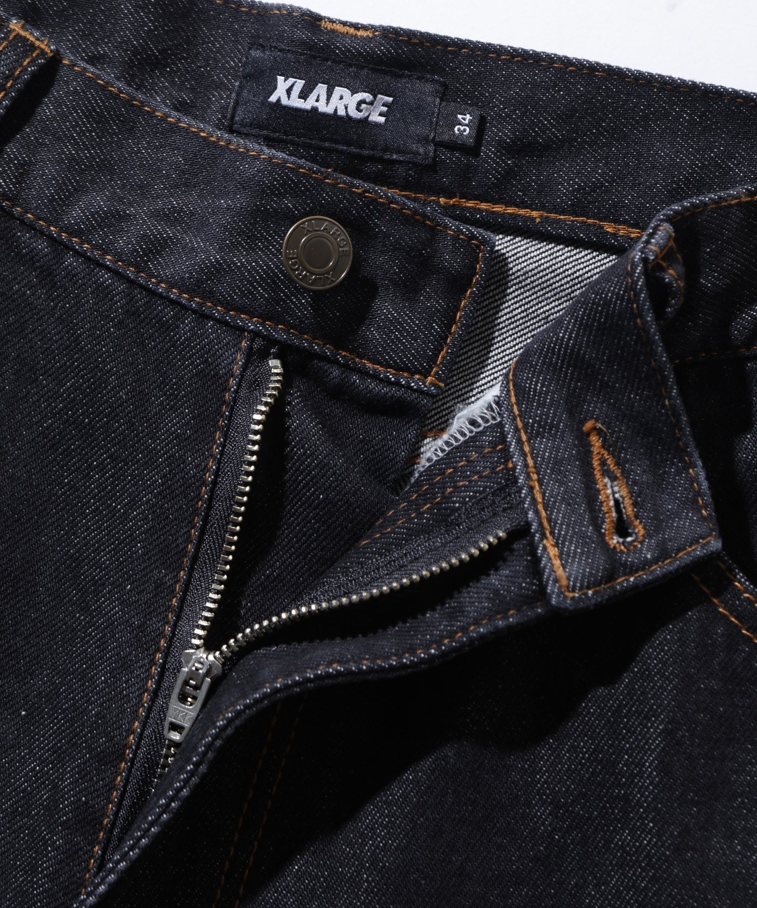 กางเกงยีนส์ผ้าเดนิม XLARGE รุ่น RAGE LOGO DENIM PANTS