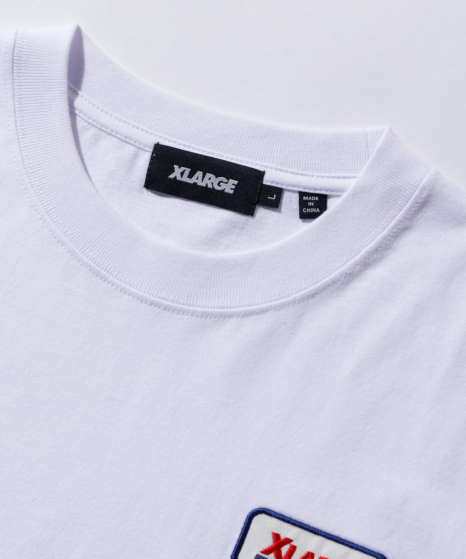เสื้อยืดแขนสั้น XLARGE รุ่น Logo Patched S/S Pocket Tee